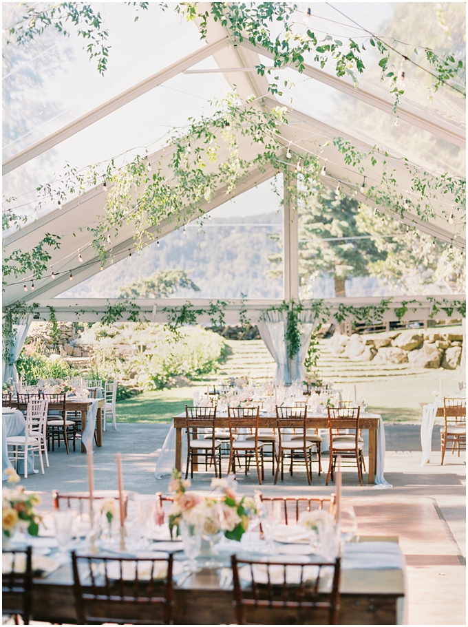 wedding reception tent at the griffin house in hood river oregon with lush florals and greenery